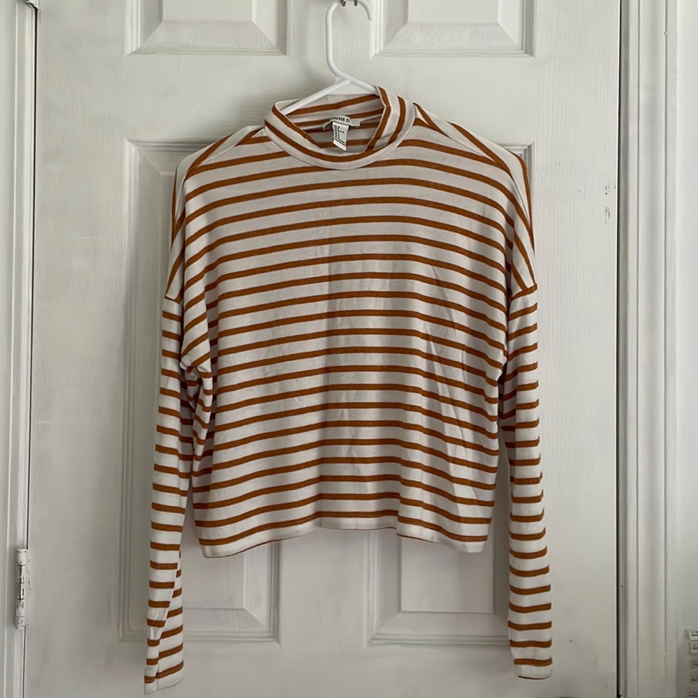 Orange and white striped mock neck sweater